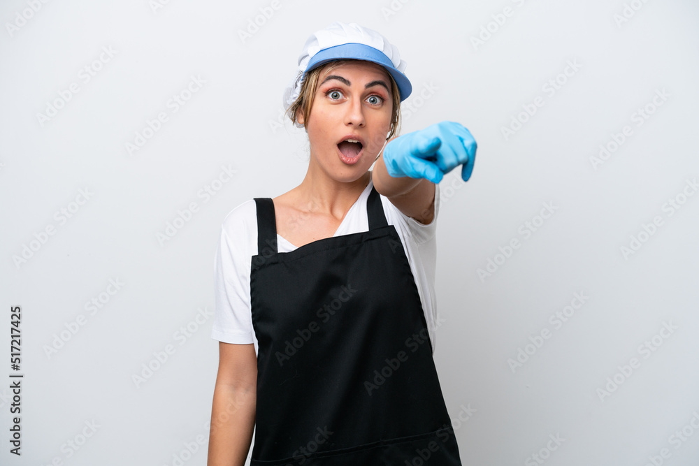 Fishwife woman isolated on white background surprised and pointing front Fishwife woman isolated on white background surprised and pointing front