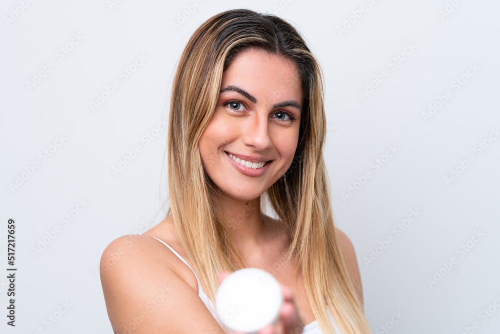 Young caucasian woman isolated on white background with moisturizer and offering it Young caucasian woman isolated on white background with moisturizer and offering it