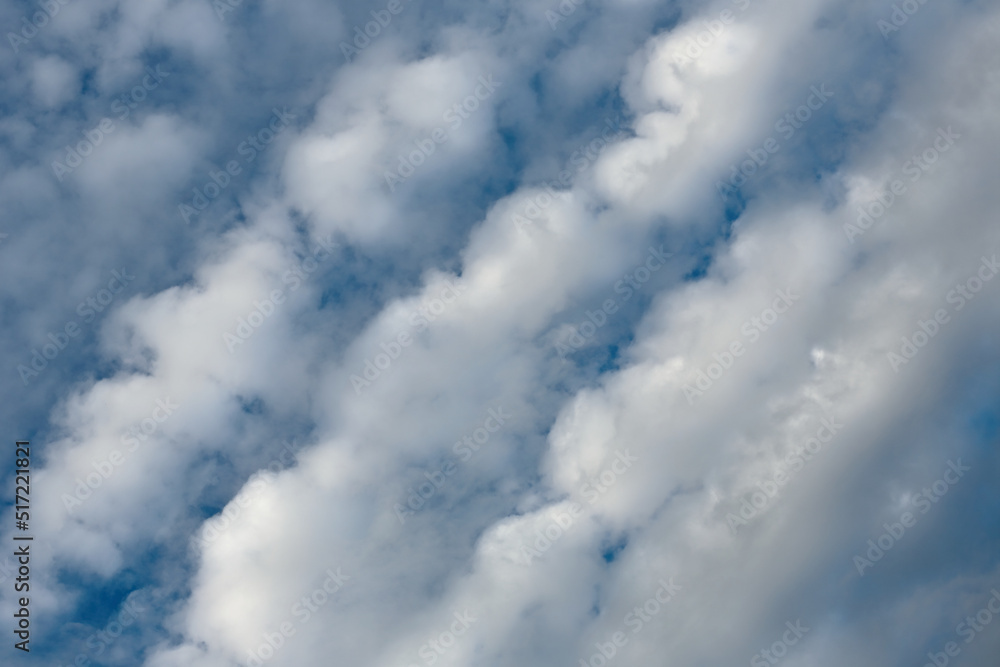Flyffy clouds in lines in blue summer sky Flyffy clouds in lines in blue summer sky