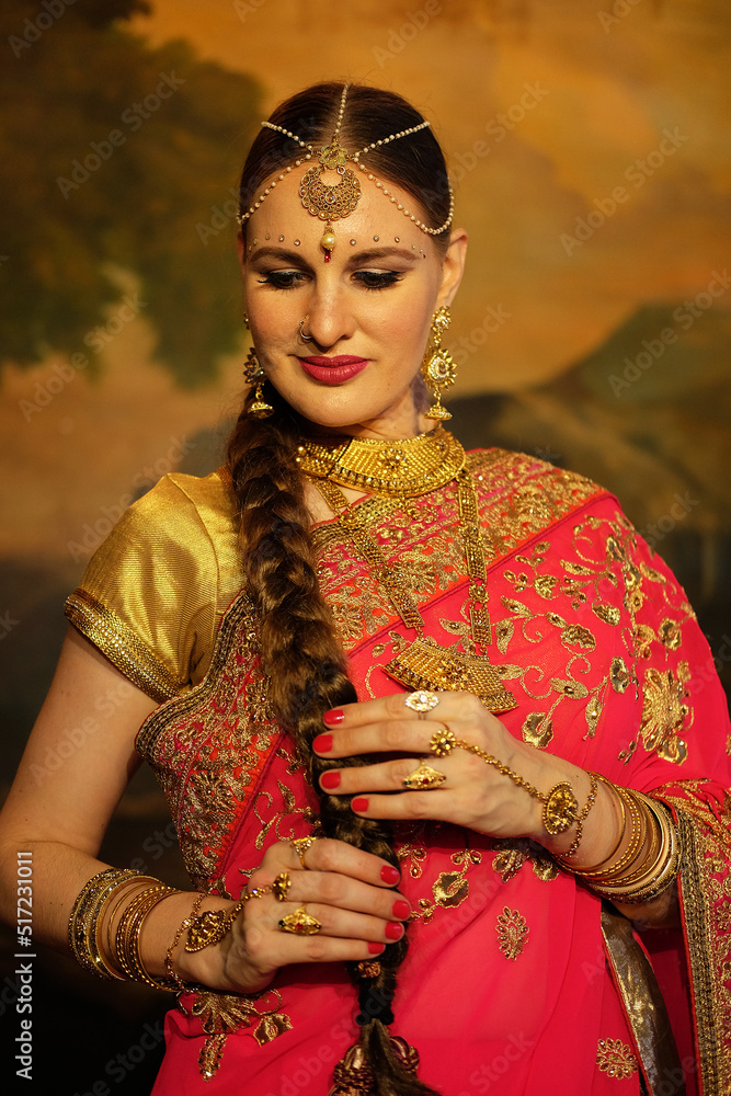 Beautiful woman in traditional indian dress and jewelry.