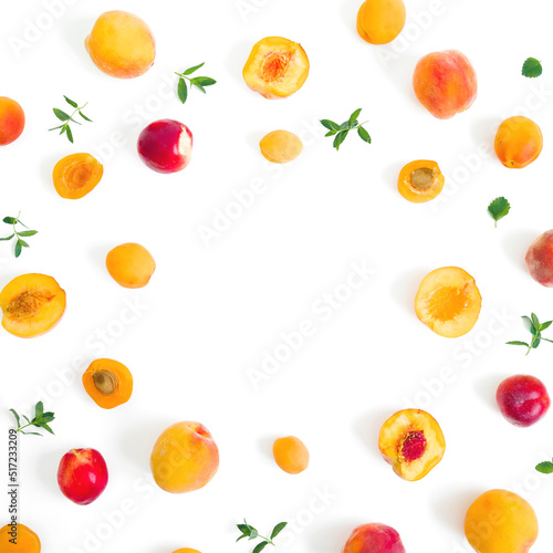 Fototapeta Naklejka Na Ścianę i Meble -  Sliced peaches and apricots with mint on white. Top view. Flat lay