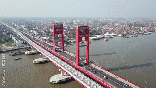 Aerial view of Ampera bridge in Indonesia with traffic during the daytime photo