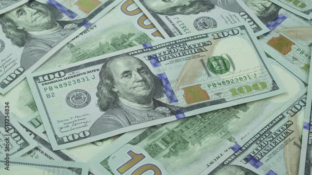 US 100 dollar bills rotating background. USA trade. Business and Finance concepts. US 100 dollar bills rotating background. USA trade. Business and Finance concepts.