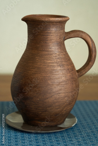      Ceramics, a ceramic product made with your own hands, made on a potter's wheel, a jug, a mug, clay.  © nikolay_alekhin