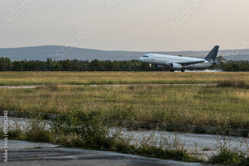 Wallpaper Mural Arriving flight at the airport in summer season. Torontodigital.ca