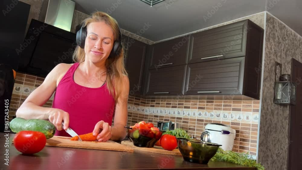 girl cutting salad in the kitchen girl cutting salad in the kitchen