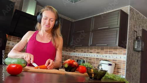 girl cutting salad in the kitchen