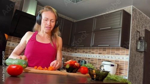 girl cutting salad in the kitchen