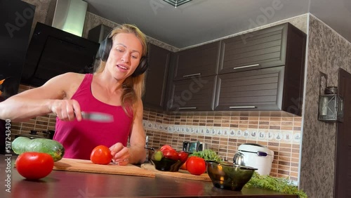 girl cutting salad in the kitchen