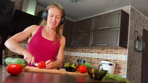 girl cutting salad in the kitchen