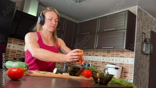 girl cutting salad in the kitchen