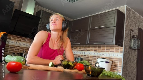 girl cutting salad in the kitchen