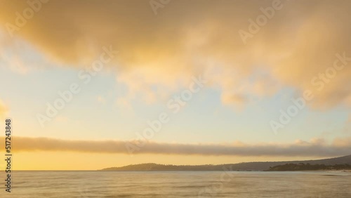 Time lapse of colorful clouds at sunset over the Pacific Ocean. Shot near Monterey on cthe entral coast of California photo