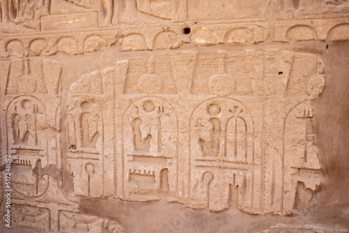 Different hieroglyphs on the walls and columns in the Karnak temple. Karnak temple is the largest complex in ancient Egypt.