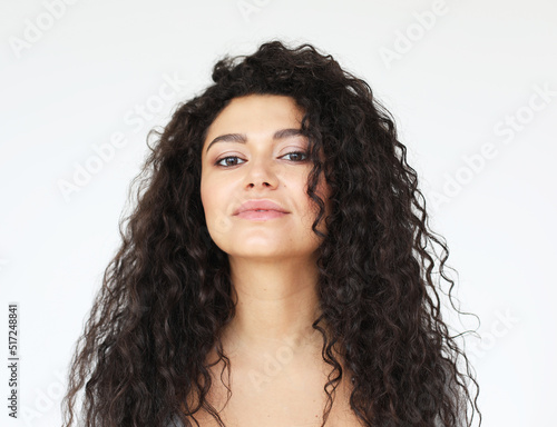 young smiling african woman wearing casual shirt, feel happy and smiling, over white background