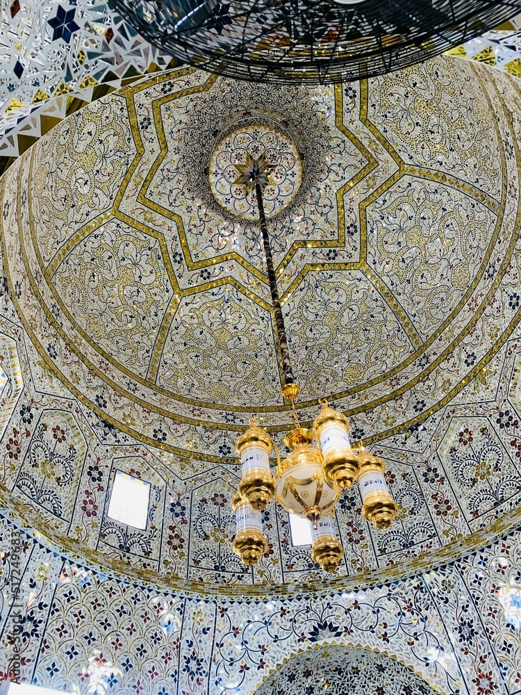 A tomb decorated with unique artwork and an amazing chandelier in punjab,pakistan.