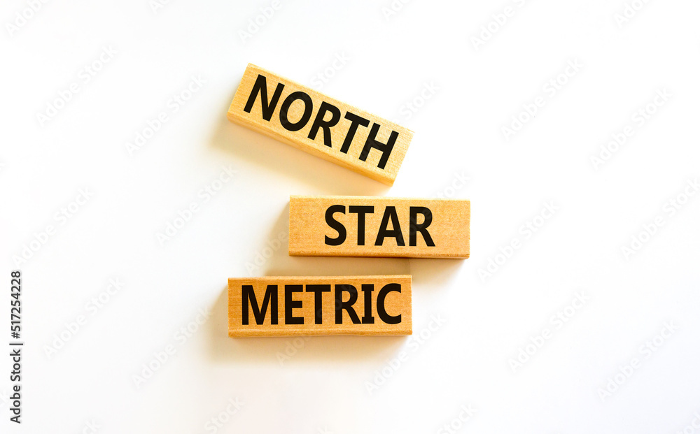 North star metric symbol. Concept words North star metric on wooden blocks on a beautiful white table white background. Business finacial and north star metric concept. Copy space. North star metric symbol. Concept words North star metric on wooden blocks on a beautiful white table white background. Business finacial and north star metric concept. Copy space.