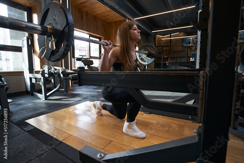 Fit woman doing leg workout at gym © Viacheslav Yakobchuk