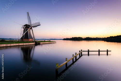 Windmill at blue hour from Paterswoldsemeer near Groningen city, Netherlands.