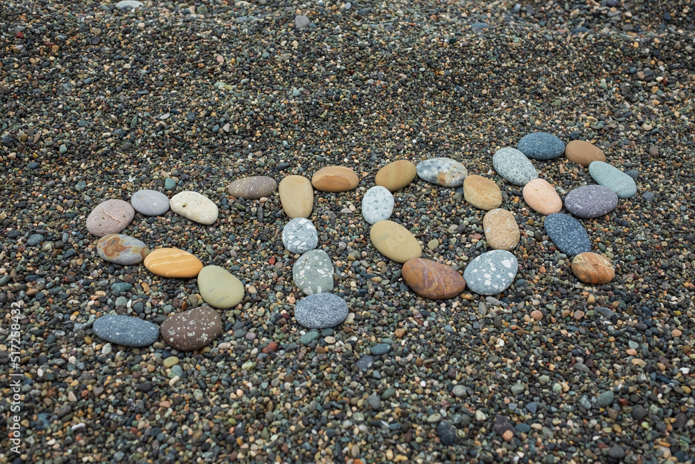 Text stop made from stones on sandy beach. Text stop made from stones on sandy beach.