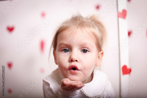 A European girl sends an air kiss