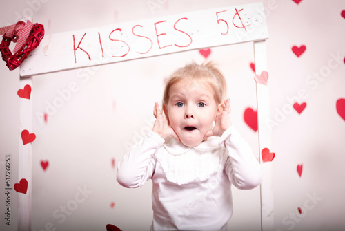 Surprised girl against the background of hearts