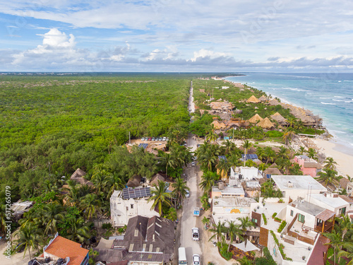 Aerial done view of Tulum beach road between tropical jungle and Caribbean beach on a cloudy afternoon in Tulum photo