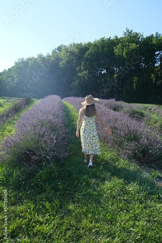 Woman walking through a lavender field