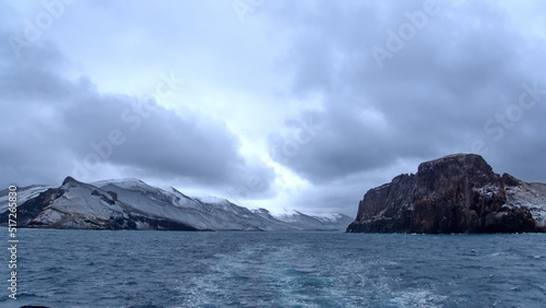 Snow dusted mountains around the pass at the entrance to the crater bay in Deception Island, Antarctica © Angela