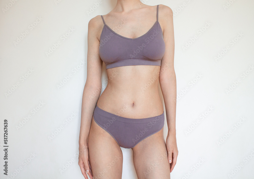 Woman Body Young sexy woman with perfect body in underwear standing on white background Woman Body Young sexy woman with perfect body in underwear standing on white background