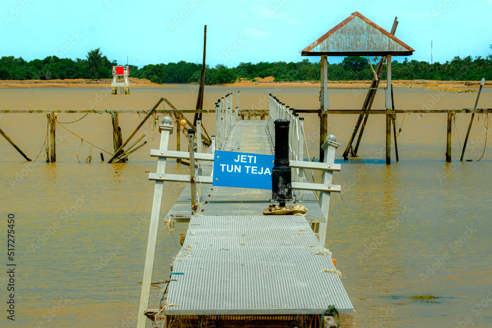Image of a wooden old pier by a river in Pekan, Pahang, Malaysia