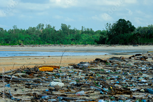 Pollution at the beach with many rubbish in Kuala Penor, Pekan, Pahang, Malaysia. photo