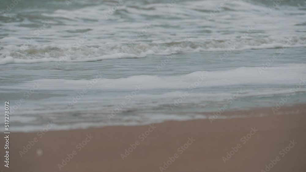 Stormy sea waves with foamy white texture. sand beach Stormy sea waves with foamy white texture. sand beach