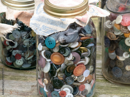 Jars of  old buttons are  a teasure for people who sew, or do crafts photo