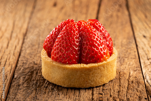 Принти на полотні Tasty strawberry tartlet on the table.