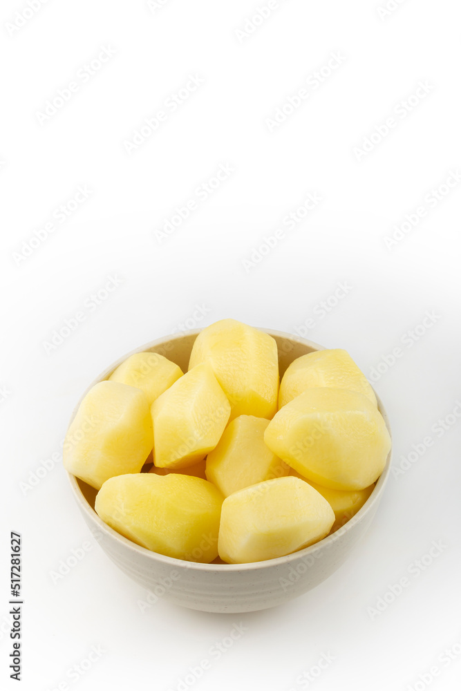 Peeled raw potatoes isolated on white background. Peeled raw potatoes isolated on white background.