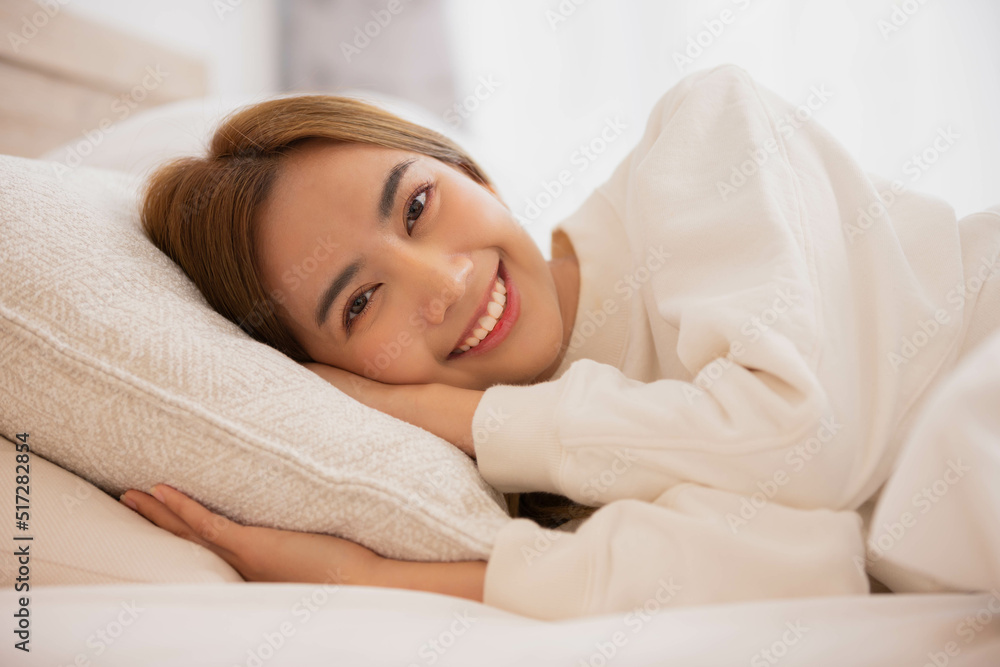 Asian women sleeping and sweet dream on white bed in bedroom Asian women sleeping and sweet dream on white bed in bedroom