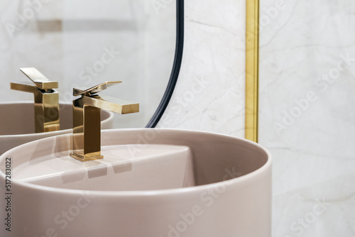 Canvas Print Golden shiny water tap over washbasin in bathroom
