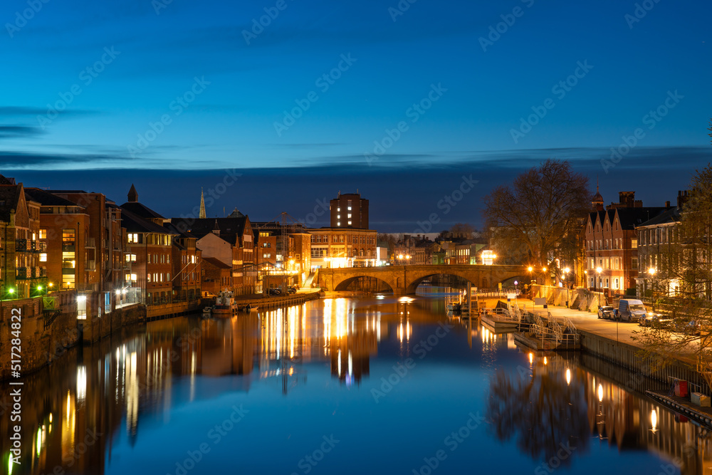 York cityscape seen across river Ouse at dusk. England 