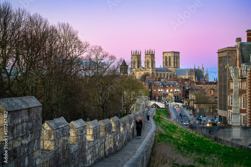 The city of York in England with its medieval wall and the York Minster at sunset photo