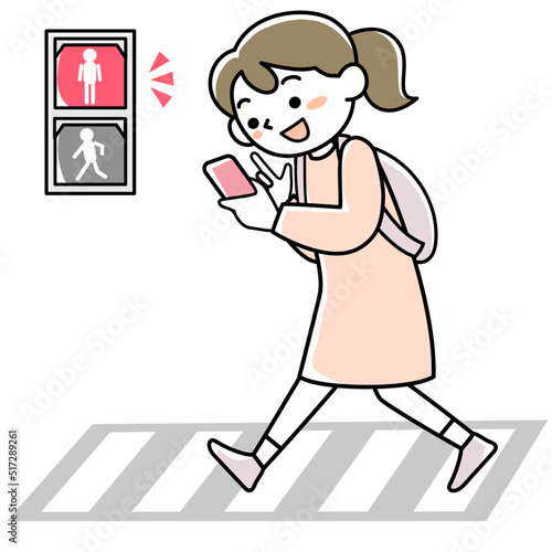 歩きスマホをしていて赤信号に気づかない若い女性