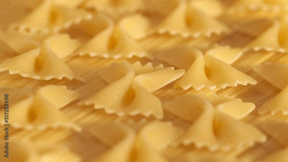 Background Of Spaghetti Pasta. Uncooked Italian Pasta Golden Rotating Backdrop. Healthy Eating Concept. Raw Dried Organic Pasta. Long Macaroni, Rotating Background. Italian Culture Background Of Spaghetti Pasta. Uncooked Italian Pasta Golden Rotating Backdrop. Healthy Eating Concept. Raw Dried Organic Pasta. Long Macaroni, Rotating Background. Italian Culture