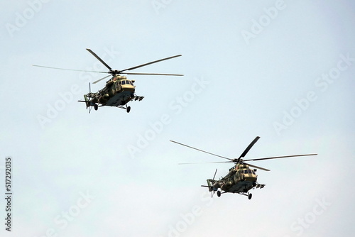 Fototapeta Naklejka Na Ścianę i Meble -  A group of multi-purpose Mi-8AMTSh helicopters in the sky over Moscow's Red Square during the dress rehearsal of the Victory Air Parade                              