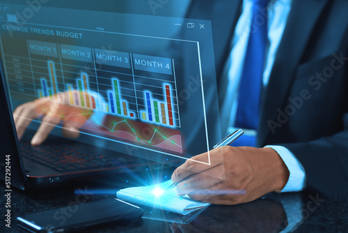 businesmen working on laptop, making expense trends budget. Excel, Statistics charts, Business concept