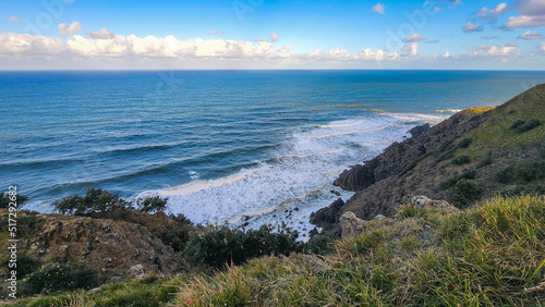 Waves crashing on Tallow Beach below the lighthouse at Byron Bay in Australia