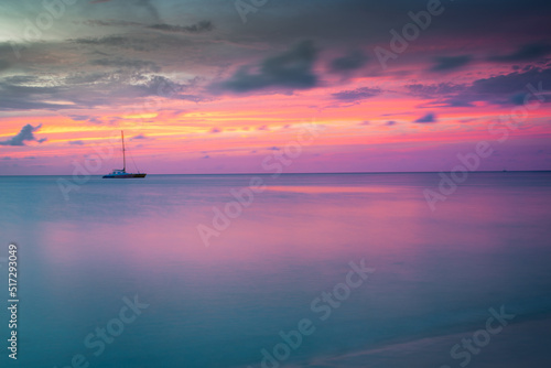 Ships at peaceful sunset on Caribbean sea of Aruba, Dutch Antilles
