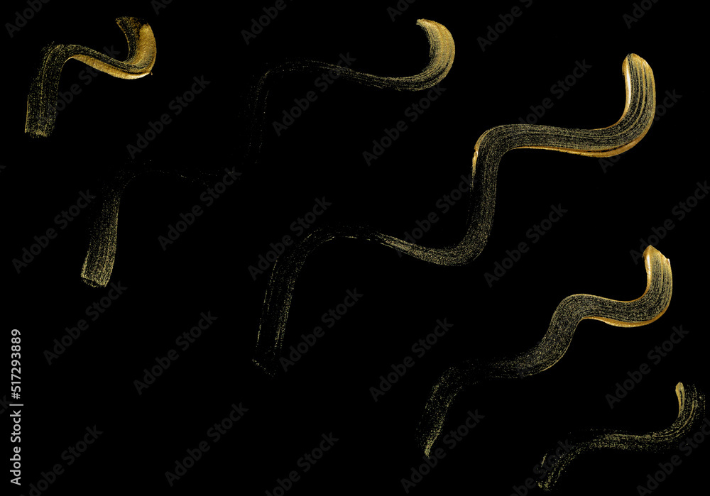 Golden set of brush stroke texture design isolated on black background. Realistic mascara golden smear template with clipping path. Golden set of brush stroke texture design isolated on black background. Realistic mascara golden smear template with clipping path.
