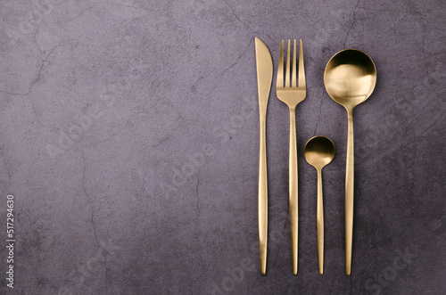 Clean golden metal cutlery photo