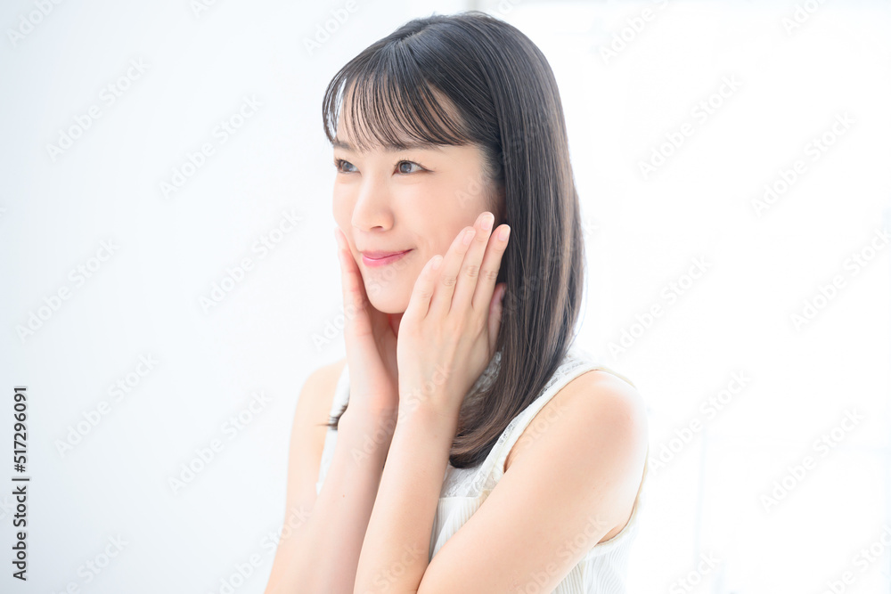 Profile of a young woman concerned about her skin Profile of a young woman concerned about her skin