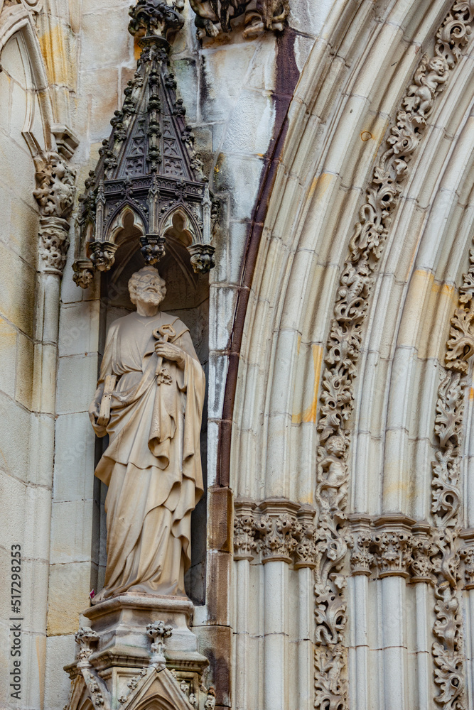 saint cathedral statue and engraving in the main arch entrance